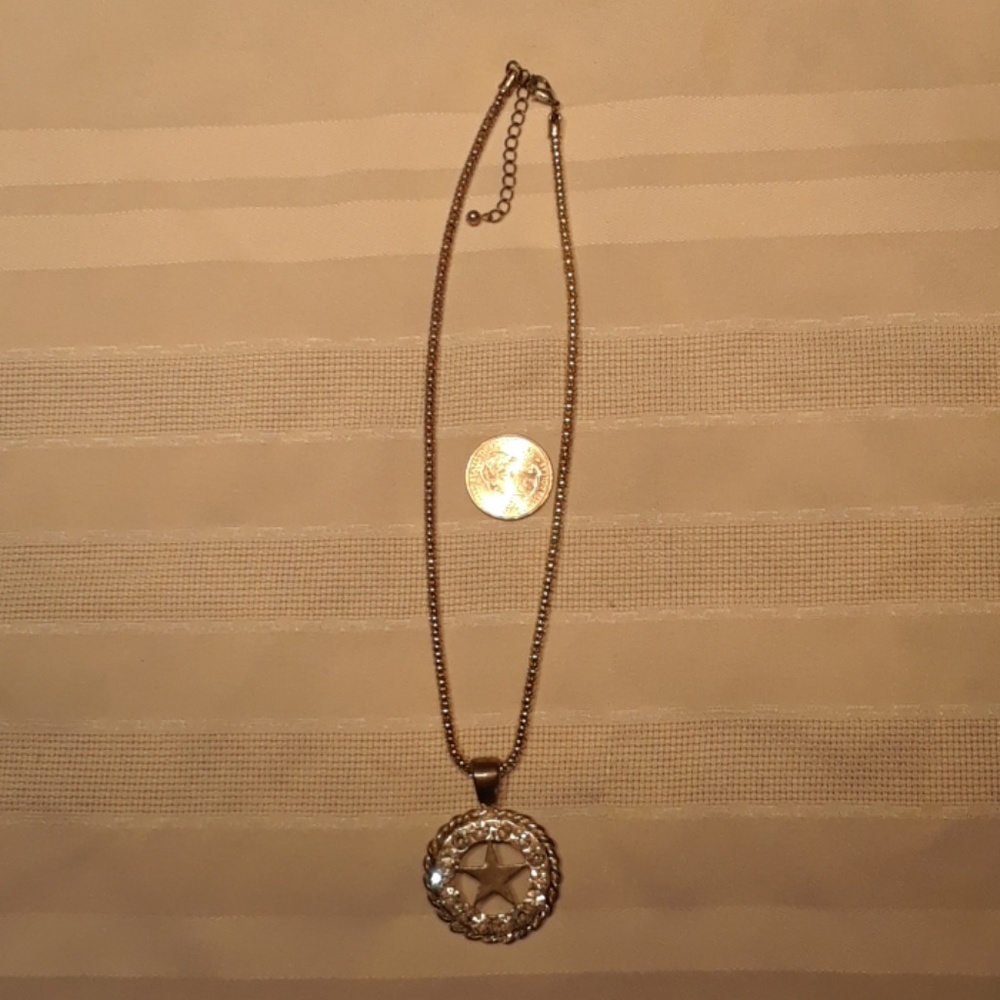 Silver tone star and circle in bling necklace.